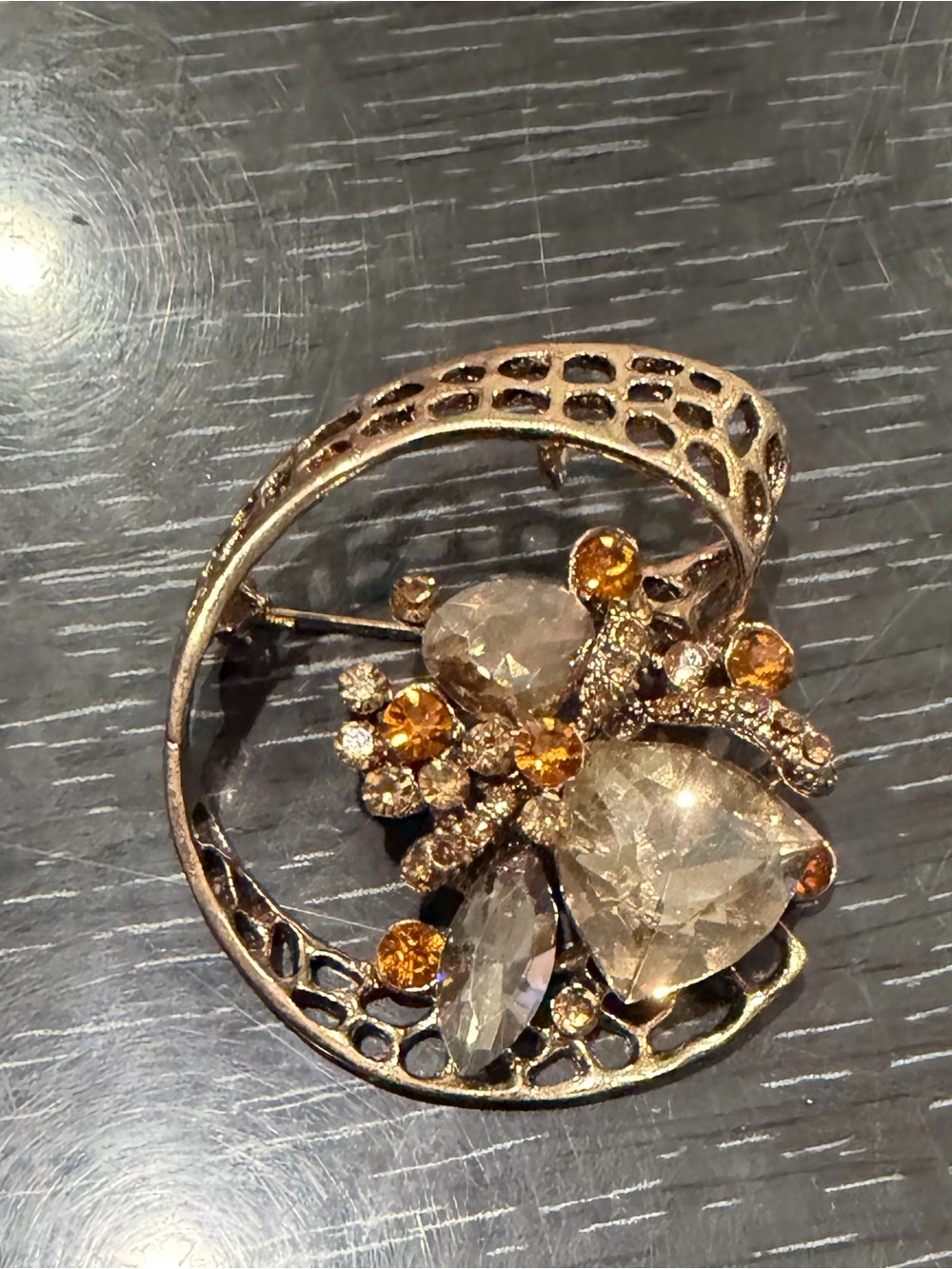 Gold-Tone Floral Crystal Brooch with Amber Accents